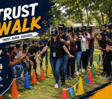 Employees participating in a trust-building exercise where teammates guide each other through challenges using communication and collaboration.